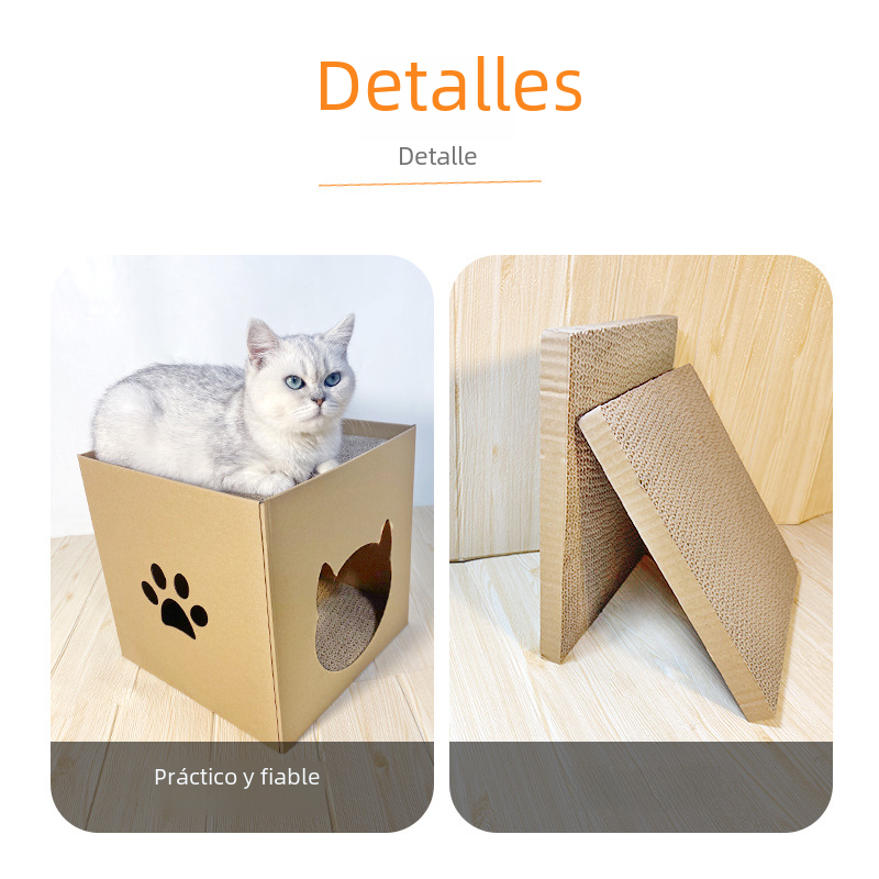 White cat on a cardboard scratcher box beside a folded scratching ramp